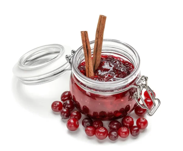 Jar with tasty cranberry sauce on white background — Stock Photo, Image