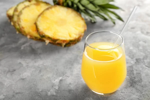 Glass of sweet pineapple juice on table — Stock Photo, Image