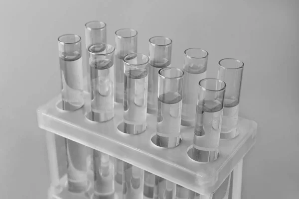 Test tubes with water on light background — Stock Photo, Image