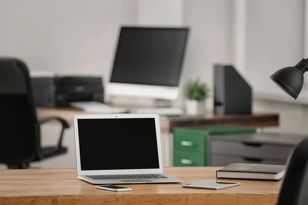 Comfortable workplace with laptop on table — Stock Photo, Image