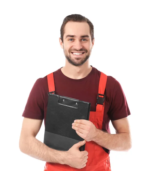 Young car mechanic with clipboard on white background — Stock Photo, Image