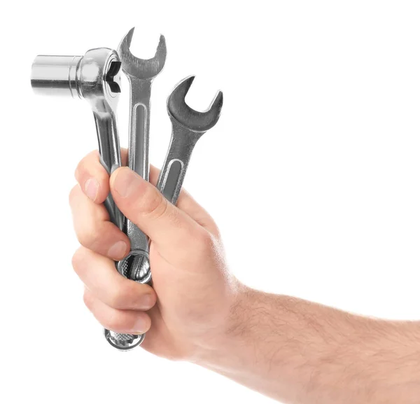 Hand of car mechanic holding tools on white background — Stock Photo, Image