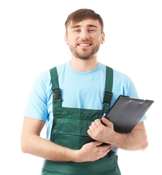 Young car mechanic with clipboard on white background — Stock Photo, Image