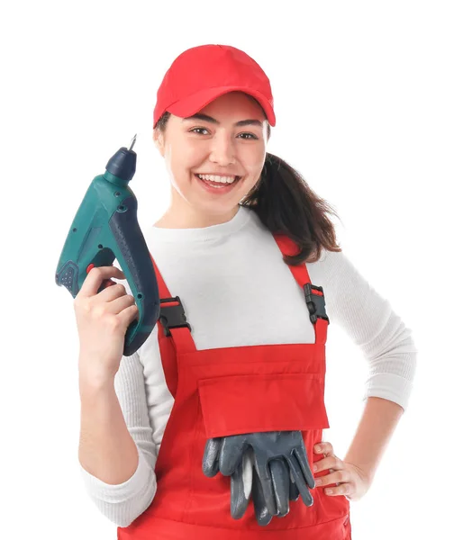 Vrouwelijke monteur in uniform met boor op witte achtergrond — Stockfoto