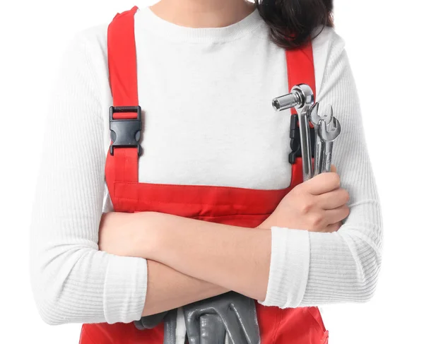 Vrouwelijke monteur in uniform met instrumenten op witte achtergrond, close-up — Stockfoto