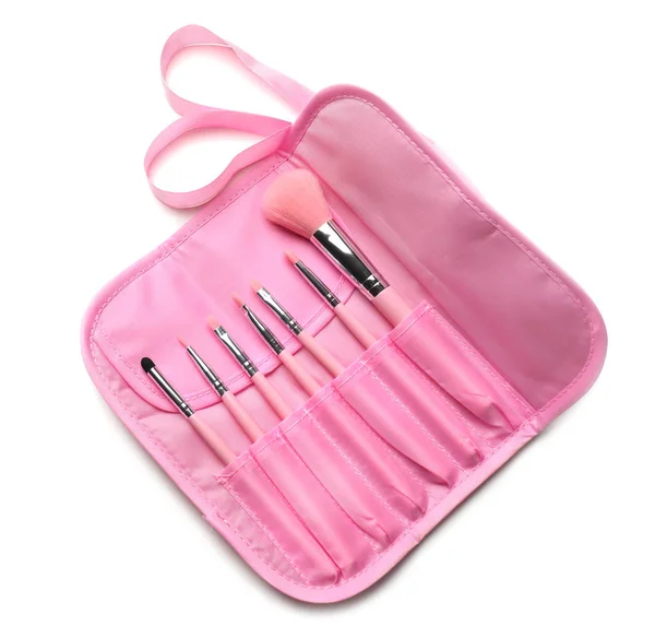 Set of makeup brushes in pink case on white background — Stock Photo, Image