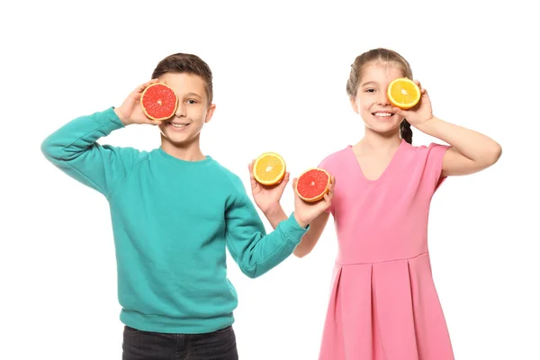 Funny little children with citrus fruits on white background — Stock Photo, Image