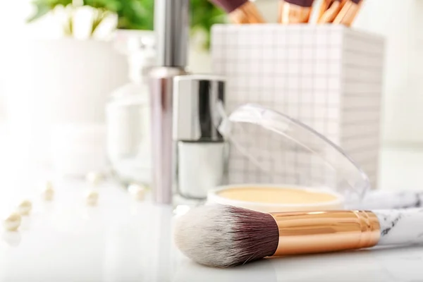Cosmetic brush on white table — Stock Photo, Image