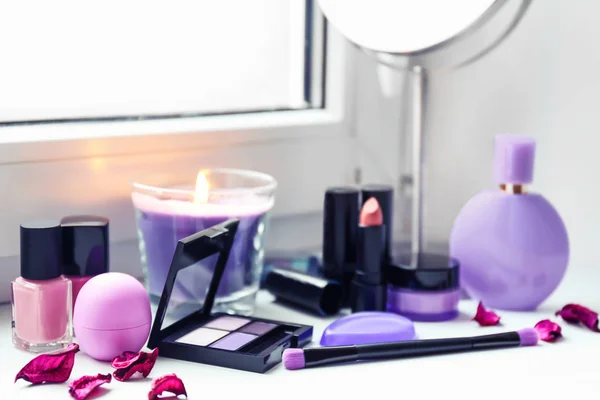 Set of decorative cosmetics on windowsill — Stock Photo, Image