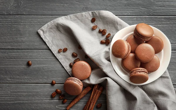 Composition with chocolate macarons on wooden background — Stock Photo, Image