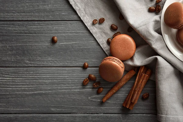 Composition with chocolate macarons on wooden background — Stock Photo, Image