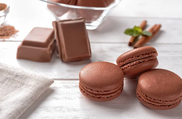 Delicious chocolate macarons on table — Stock Photo, Image