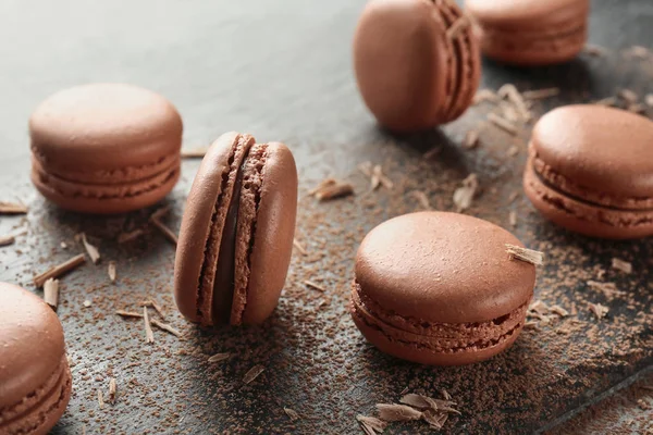 Delicious chocolate macarons on table — Stock Photo, Image