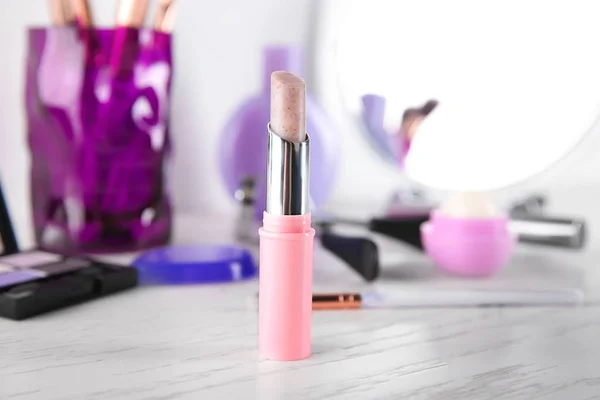 Lipstick on white wooden table — Stock Photo, Image