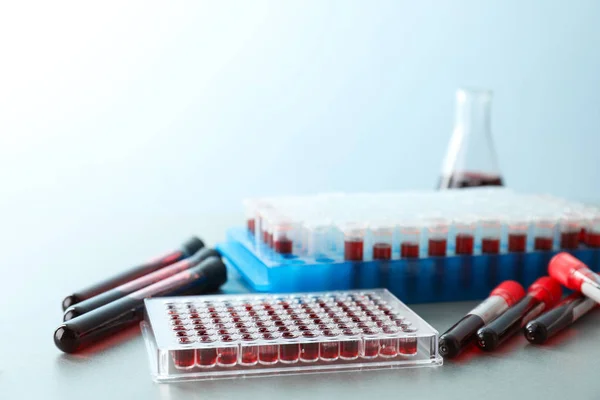 Test tubes with blood samples on table — Stock Photo, Image