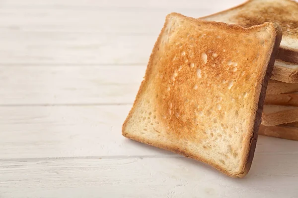 Tasty toasted bread on table — Stock Photo, Image