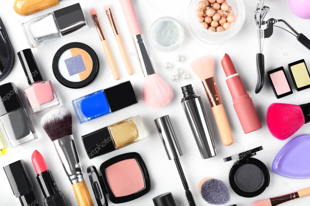Flat lay composition with decorative cosmetics on white background