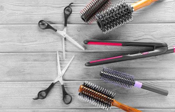 Flat lay composition with set of hairdresser's tools on wooden background — Stock Photo, Image