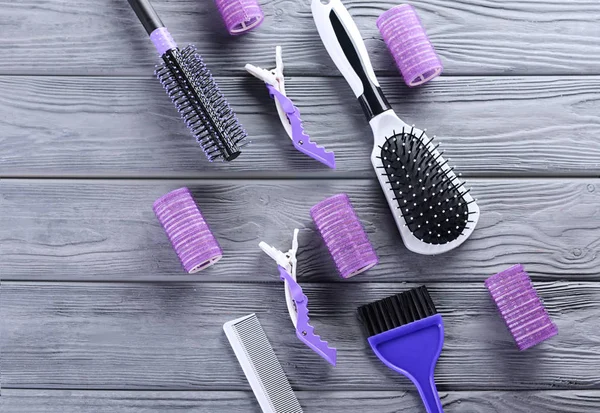 Flat lay composition with set of hairdresser's tools on wooden background — Stock Photo, Image