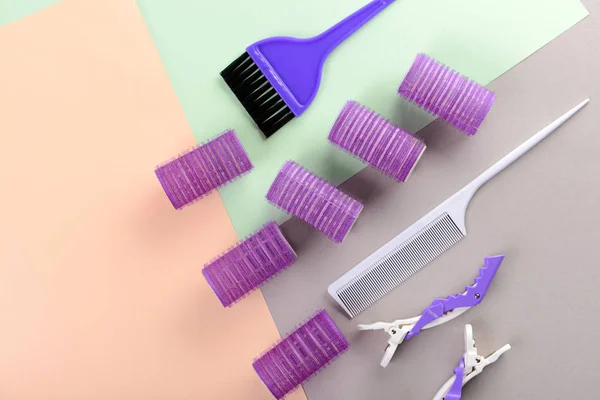 Flat lay composition with set of hairdresser's tools on color background — Stock Photo, Image