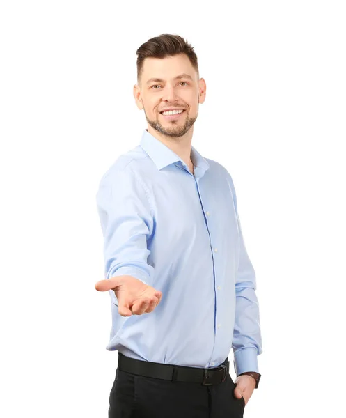 Joven empresario sosteniendo algo sobre fondo blanco — Foto de Stock