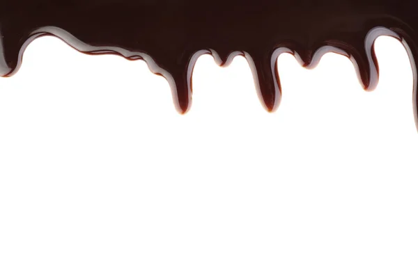 Delicioso molho de chocolate no fundo branco — Fotografia de Stock