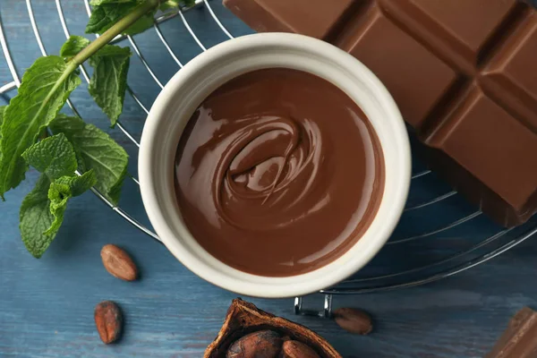 Flat lay composition with delicious chocolate on wooden table — Stock Photo, Image