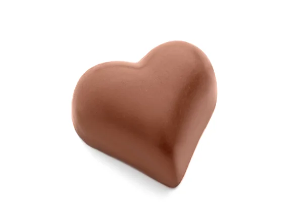 Doce de chocolate saboroso em forma de coração no fundo branco — Fotografia de Stock