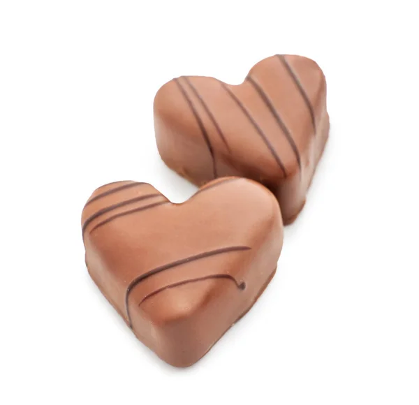 Tasty heart-shaped chocolate candies on white background — Stock Photo, Image