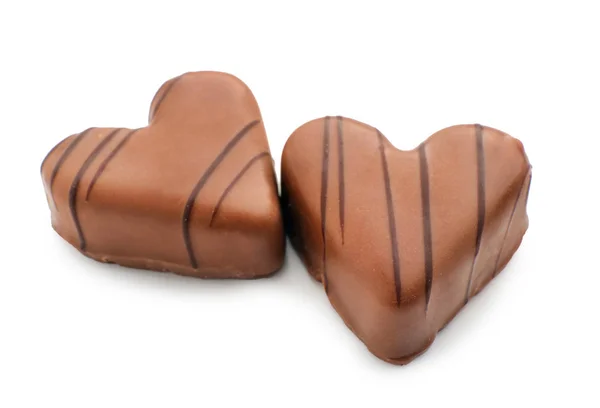 Tasty heart-shaped chocolate candies on white background — Stock Photo, Image