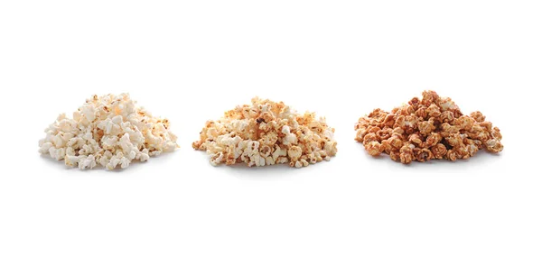 Piles of delicious popcorn on white background — Stock Photo, Image