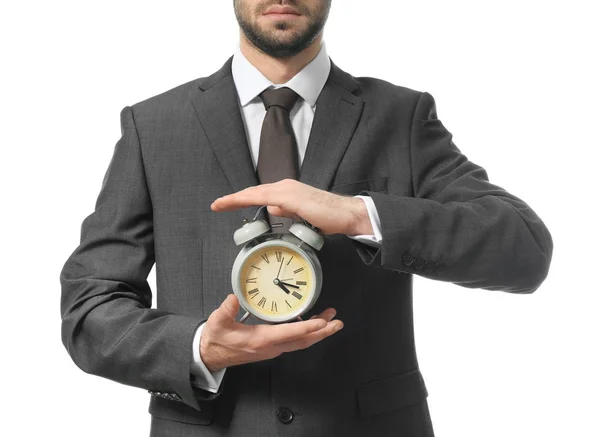 Hombre sosteniendo el reloj sobre fondo blanco. Concepto de gestión del tiempo —  Fotos de Stock
