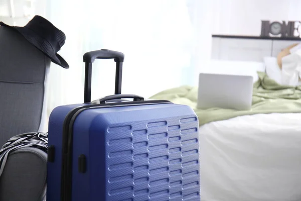 Large blue suitcase prepared for journey indoors — Stock Photo, Image