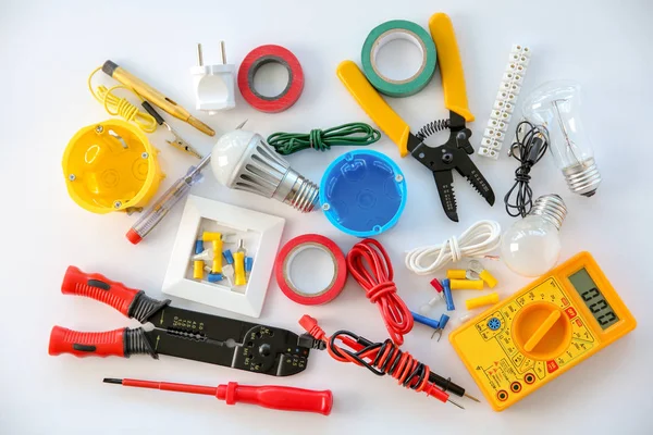 Electrician's supplies on white background — Stock Photo, Image