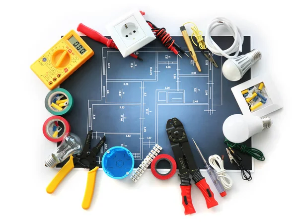 Electrician's supplies with electrical scheme on white background — Stock Photo, Image