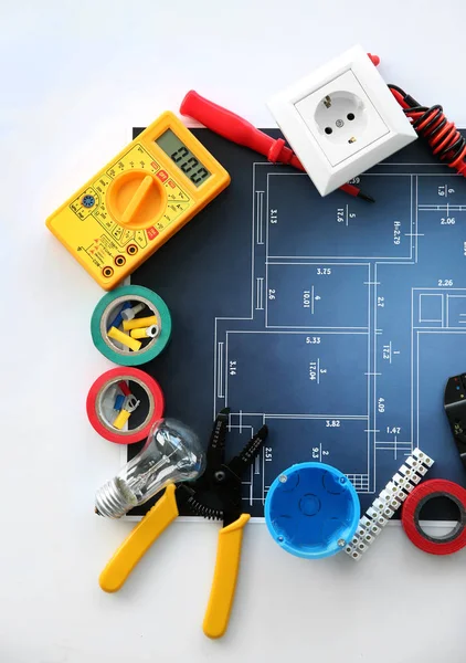 Electrician's supplies with electrical scheme on white background — Stock Photo, Image