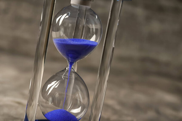 Hourglass on gray background. Time management concept