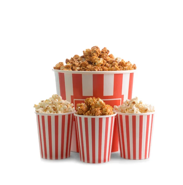 Different paper buckets of tasty popcorn on white background — Stock Photo, Image