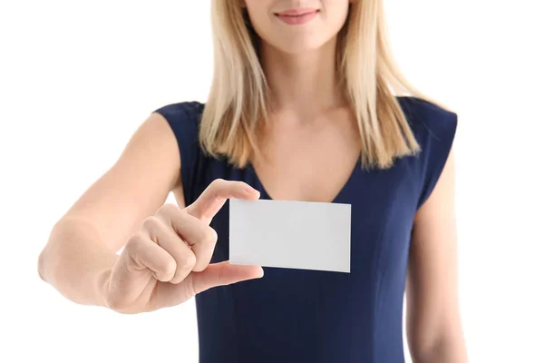 Young woman with business card on white background — Stock Photo, Image