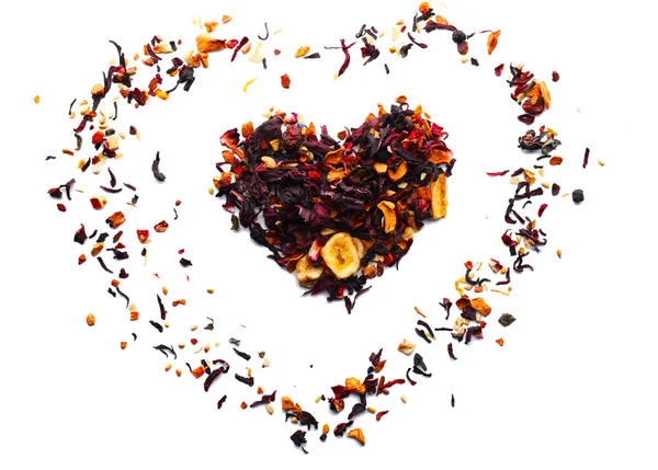 Heart made of dry fruit tea on white background — Stock Photo, Image