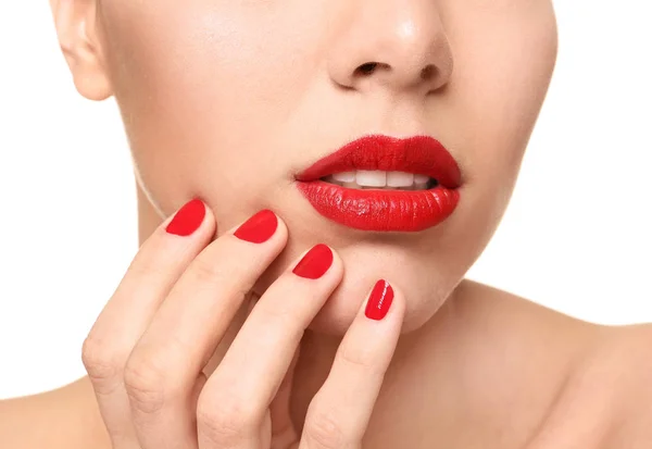 Beautiful young woman with bright lipstick and manicure on white background, closeup — Stock Photo, Image