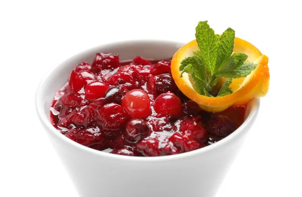 Bowl with tasty cranberry sauce, orange and mint on white background — Stock Photo, Image