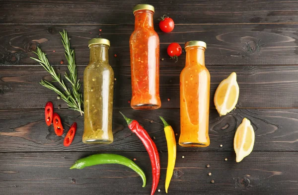 Composition with tasty sauces on wooden background, top view — Stock Photo, Image