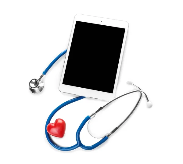 Stethoscope with small heart and tablet PC on white background — Stock Photo, Image