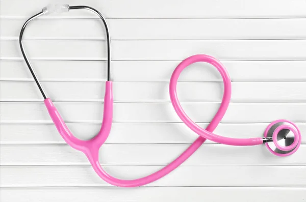 Stethoscope on white wooden background — Stock Photo, Image