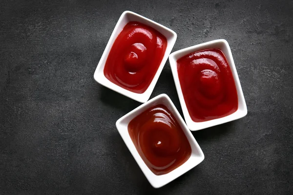 Delicious barbecue sauces in bowls on table, top view Royalty Free Stock Photos
