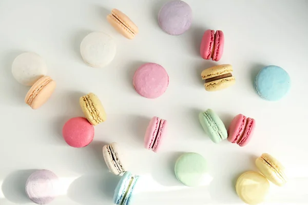 Tasty colorful macarons on white background — Stock Photo, Image