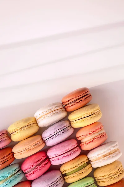 Tasty colorful macarons on white background — Stock Photo, Image