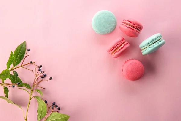Flat lay composition with tasty macarons on color background — Stock Photo, Image