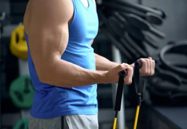 Young man training in modern gym — Stock Photo, Image